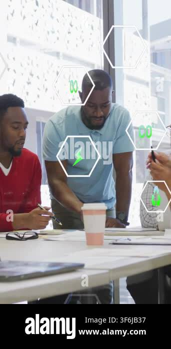 Vertical video: lead leaning over table, pointing and causing green hex ...