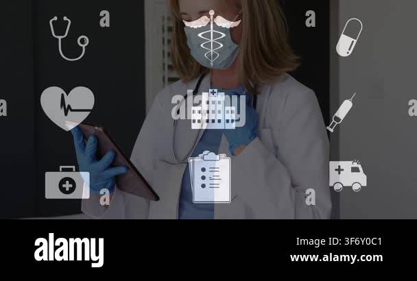 Female doctor adjusting stethoscope then tapping tablet, updating ...