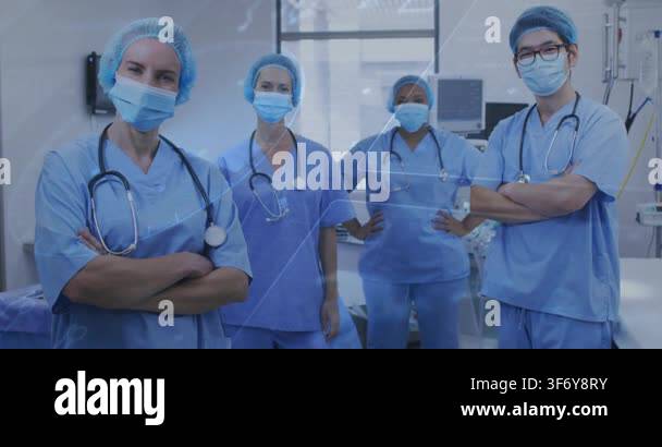 Medical team standing in OR, scrubs and masks, triangle sweeping across ...