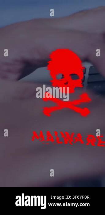 Vertical video: Man typing on laptop keys, red MALWARE warning ...