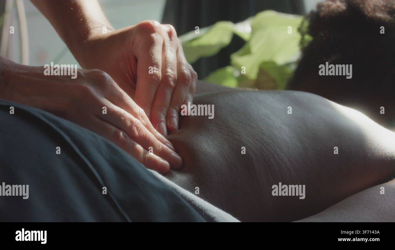 Therapist making back massage to reduce pain Stock Video Footage - Alamy