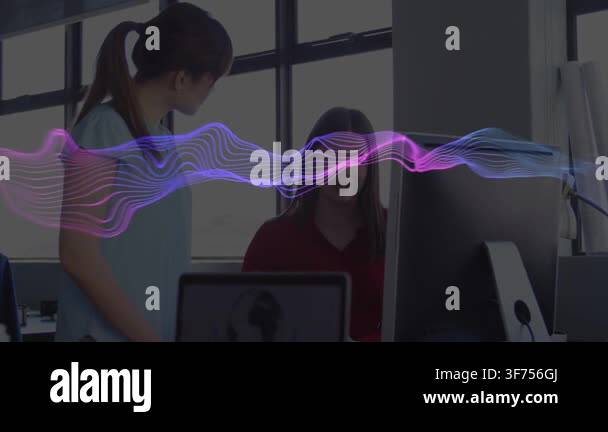 Standing woman leaning, pointing at screen, starting waveform obscuring ...