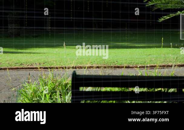 Wooden bench framing park while tech grid appearing and UI panels ...
