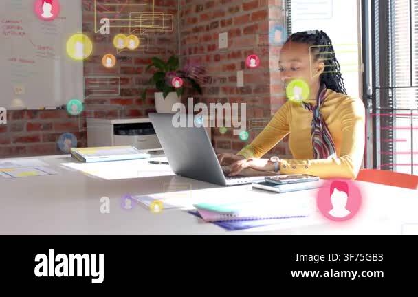 Woman typing on laptop in office, creating floating user icons and ...