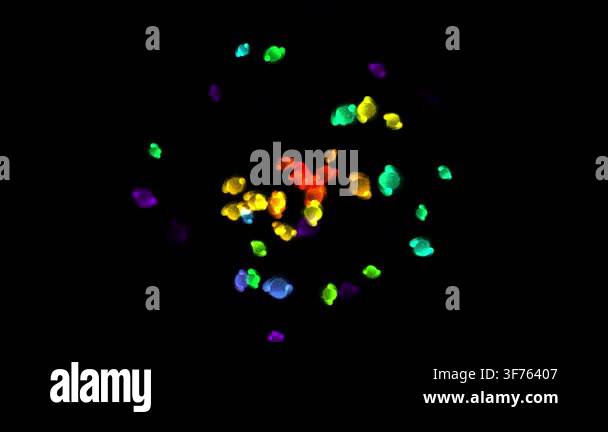 Animated colorful spinning shapes with small glowing spheres rotate ...