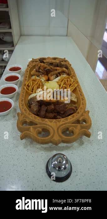 Slow motion camera panning of a traditional Central Asian meat and fish ...