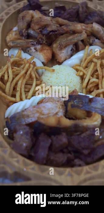 Slow motion camera panning of traditional Central Asian mixed platter ...