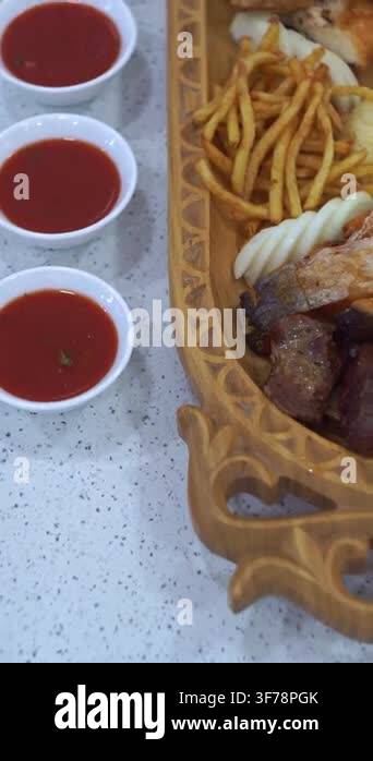 Slow motion camera panning of traditional Central Asian mixed platter ...