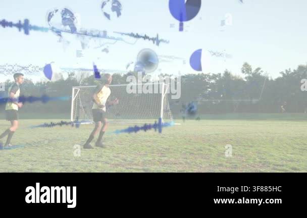 Two soccer players starting drill, moving by goal while blue charts ...