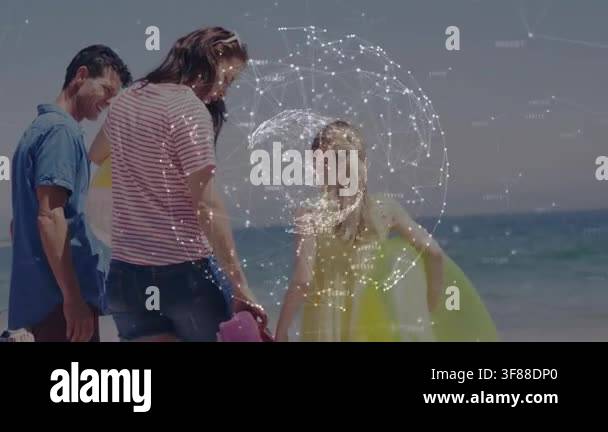 Family walking to sea, holding bags, girl holding ring, causing ...