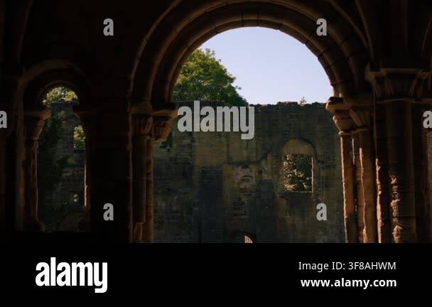 Archway in old Abbey Church ruins in England Kirkstall Abbey medium ...