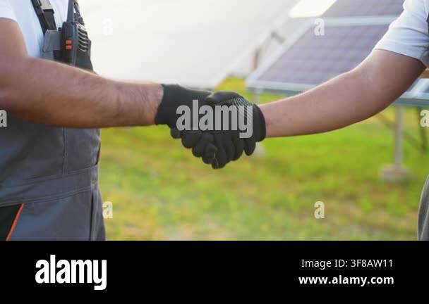 Two engineers making a deal with a handshake. Successful collaboration ...