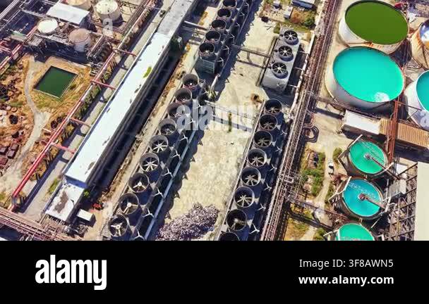 An industrial site with many cooling towers and storage tanks arranged ...