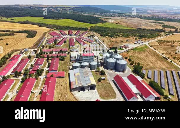 The pig farm shows buildings arranged in a circle with a central area ...