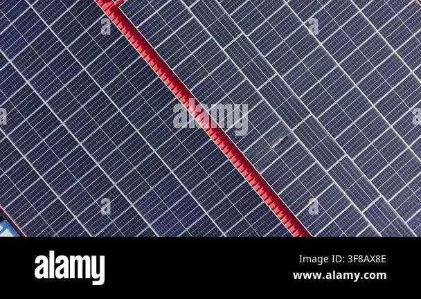 Panels arranged in rows gather solar energy in a neighborhood. Sunlight ...