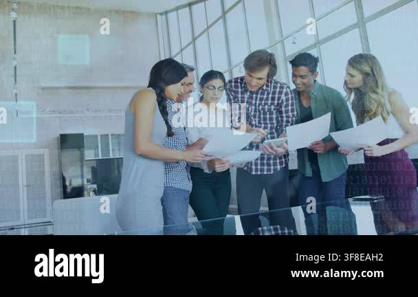 Business team gathering at glass table, checking phone sharing charts ...