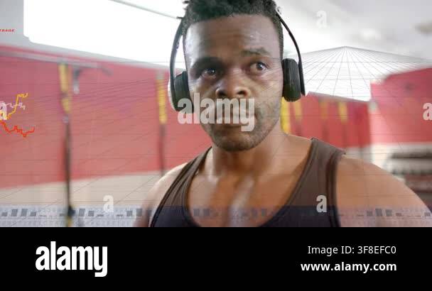 African American man adjusting over-ear headphones and tracking HUD ...