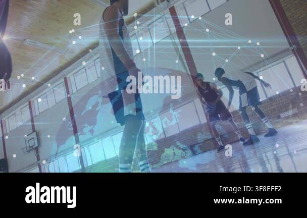 On-court basketball player driving as defender closing in, globe ...