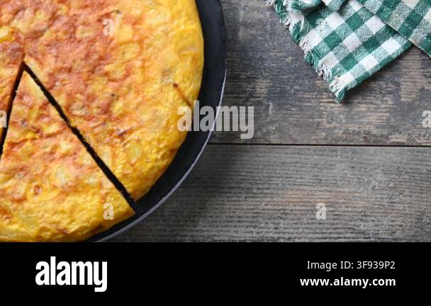 Spanish potato omelette rotating on plate Stock Video Footage - Alamy