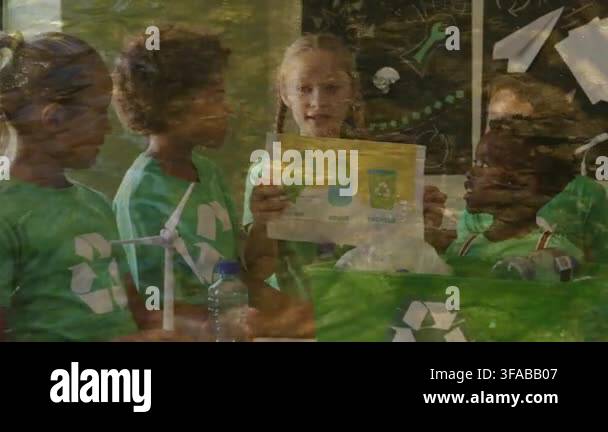 Presenter raising recycling poster, peers leaning in and placing bottle ...