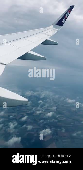 Airplane Flight Wing Of An Airplane Flying Above The Clouds View From airplane-flight-wing-of-an-airplane-flying-above-the-clouds-view-from