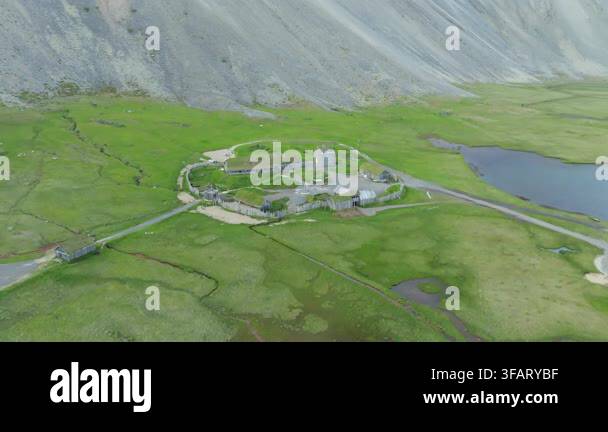 An Aerial Drone Push In Shot Reveals An Old Viking Village Film Set an-aerial-drone-push-in-shot-reveals-an-old-viking-village-film-set
