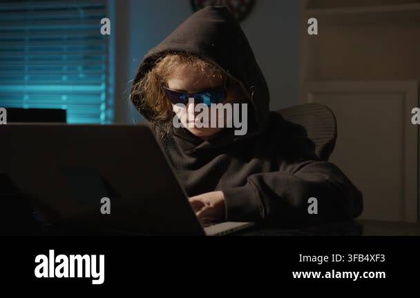 Night Hacker Child Working On Computer Hooded Hacker Kid In Cyber night-hacker-child-working-on-computer-hooded-hacker-kid-in-cyber