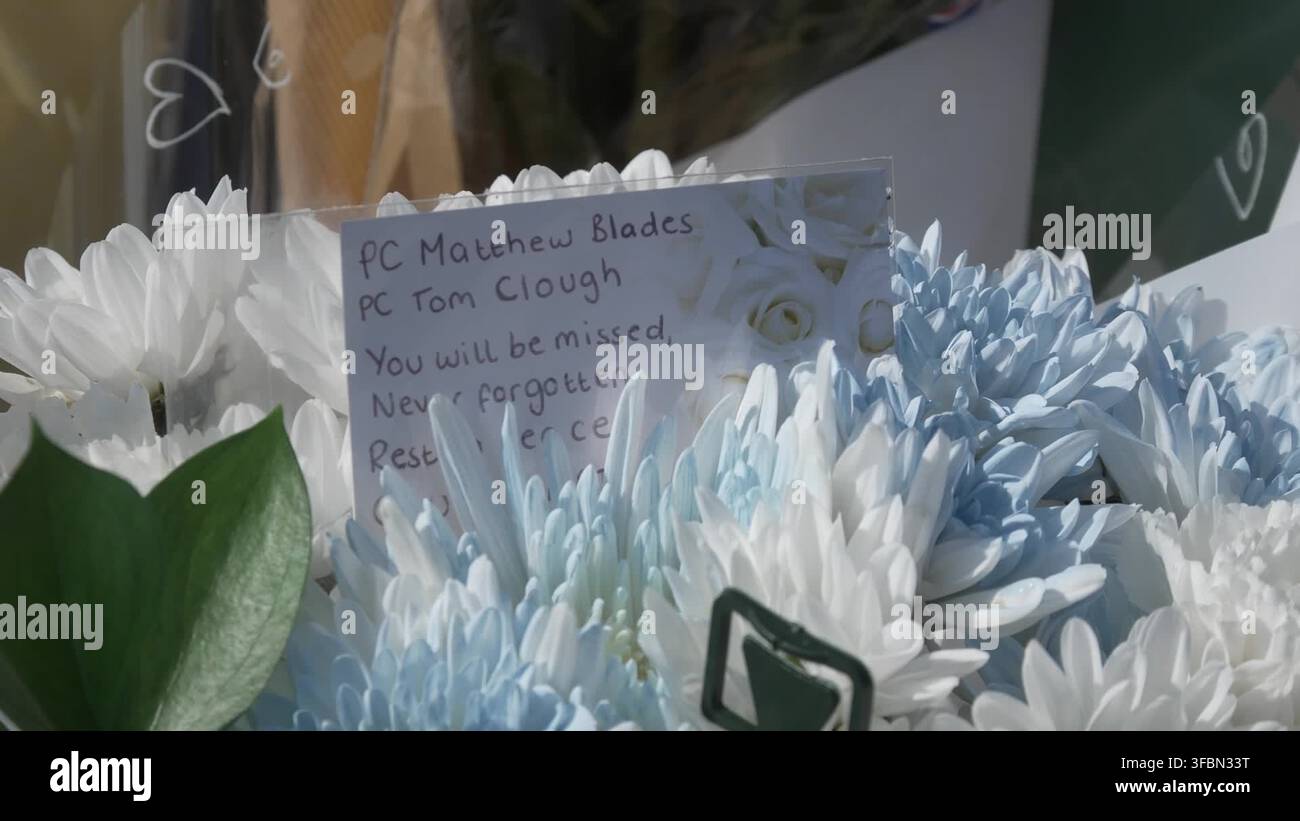 floral-tributes-left-at-cleveland-police-hq-for-officers-killed-in-a66