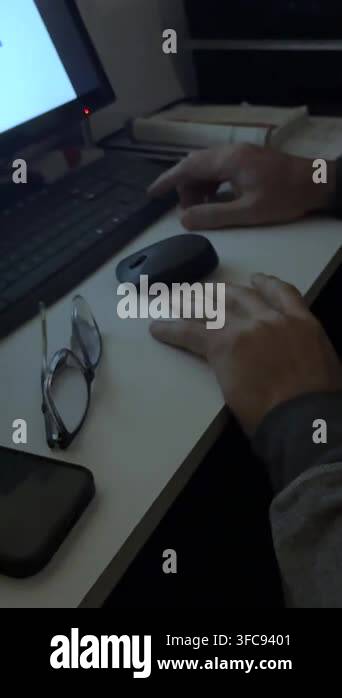 Close-up of a man's hands on a desk, while analyzing a complex business ...