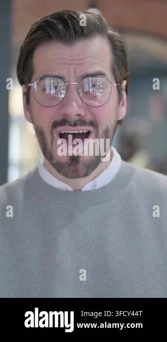 Portrait of Young Man Feeling Shocked, Surprised , Vertical Video Stock ...