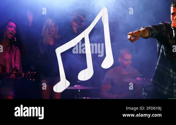 Band starting song on stage, lead singer moving center holding mic ...
