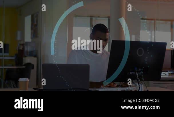 Vertical video: Typing man in white tee at office with laptop and ...