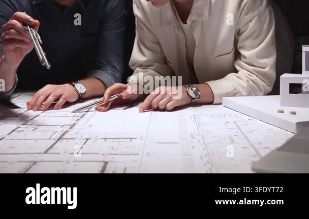 Architecture Instruments Architecture professionals analyzing technical blueprints and using ...
