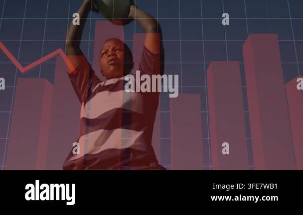 Doing passes, athlete in rugby shirt holding oval ball overhead for ...