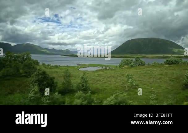 smooth-driving-pan-past-vibrant-coastal-meadows-near-bleik-andoya