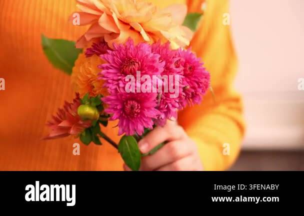 Woman showing into camera Autumn garden colorful flowers. Beautiful ...