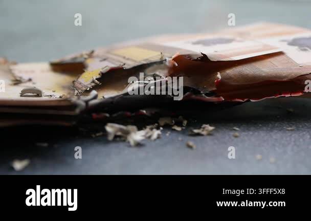 Burned banknotes show fire damage and ash on a table Stock Video ...