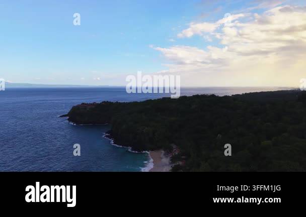 aerial-view-of-tropical-coastline-with-lush-green-forest-and-ocean