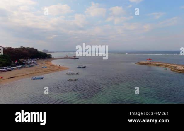 aerial-view-of-tropical-beach-coastline-with-reef-and-blue-ocean-water