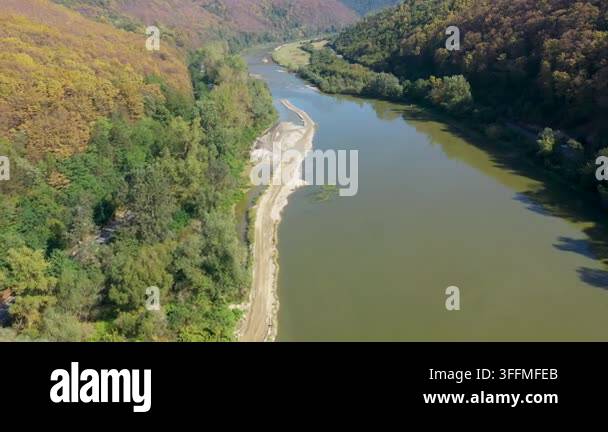 flying-over-a-river-flowing-in-a-gorge-aerial-view-stock-video-footage