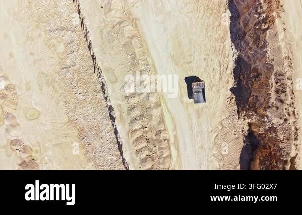Large Rocks Scattered A large quarry area is visible showing the uneven ground and heavy ...