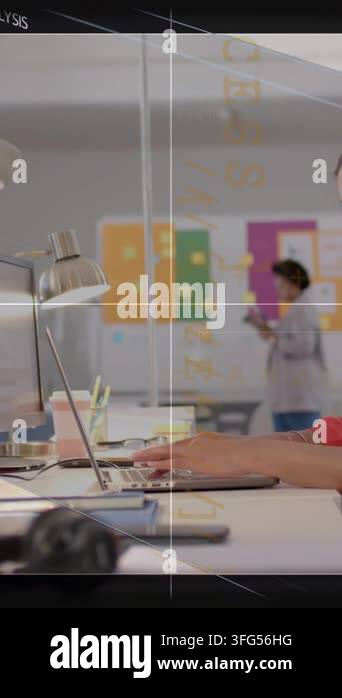 Vertical video: Seated woman typing laptop after tap while colleague ...