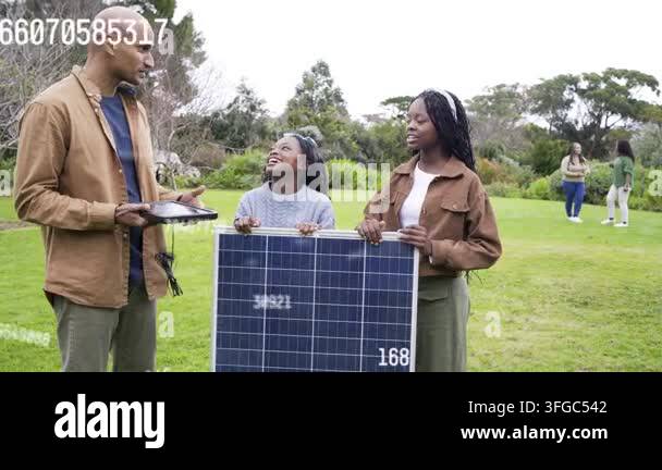 Man Gesturing On Tablet And Showing Charger Woman And Girl Holding Man Gesturing On Tablet And Showing Charger Woman And Girl Holding