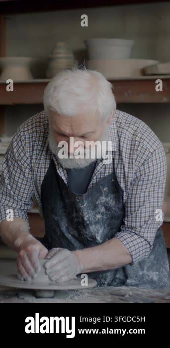 Tutorial With Images Portrait of experienced artist recording tutorial about pottery working ...