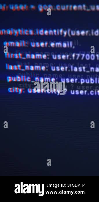 Blurred programming code on dark screen, symbolizing software ...