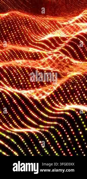 Glowing wave pattern of orange and yellow particles forming abstract ...