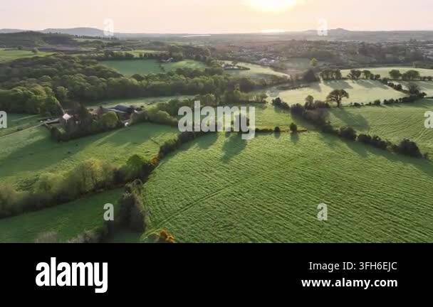 Morning Rural Vector Morning aerial view of Irish landscape with forests, hills, and gently ...