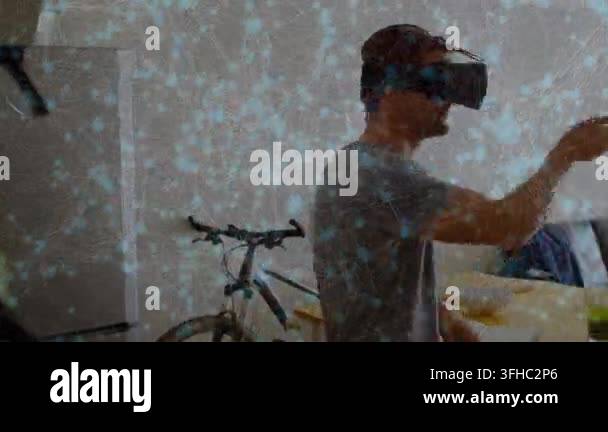 Animation of network of connections over caucasian man wearing vr ...