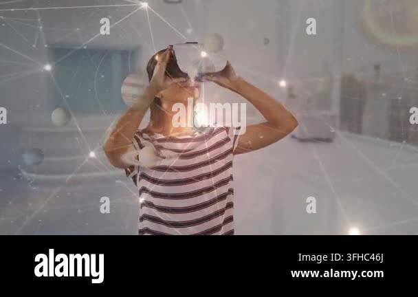Animation of network of connections over caucasian woman wearing vr ...