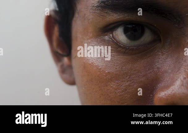 Extreme close-up on a man's dark brown eye showcasing intricate skin ...